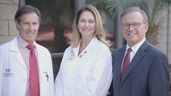 Drs. Kenneth Roth and Gayle Howard with Chris Howard